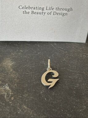 New script initial G charm! 
James Avery